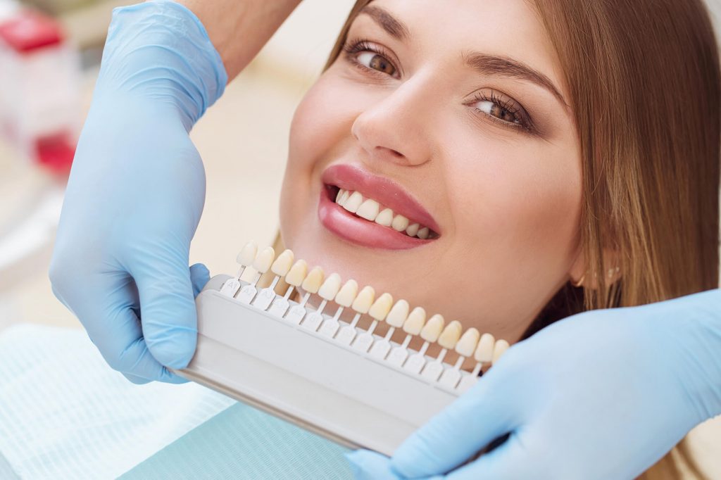 cosmetic dentist finding the perfect dental crown Wendell color for the patient