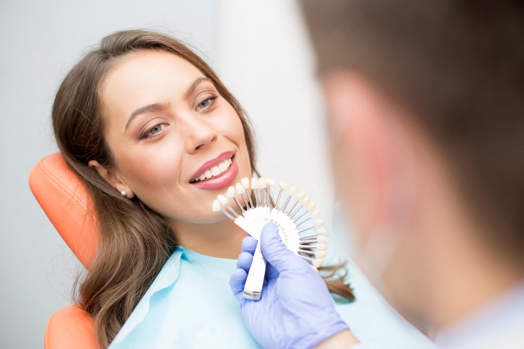 woman choosing a Dental Implants in Wendell shade