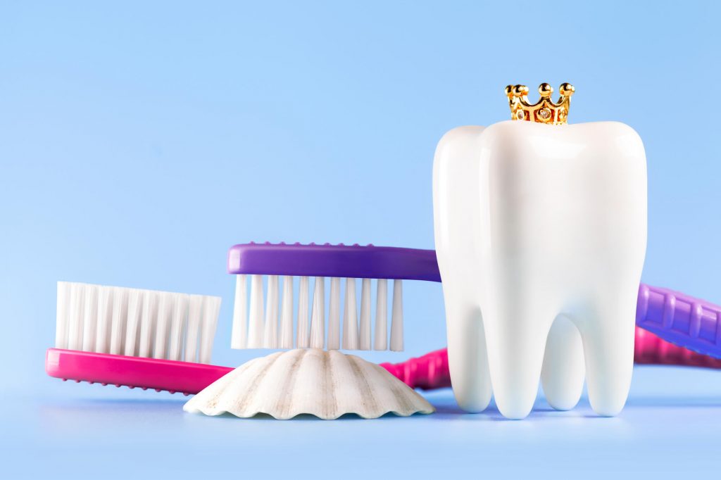 dental crown in Wilson with toothbrushes in the background