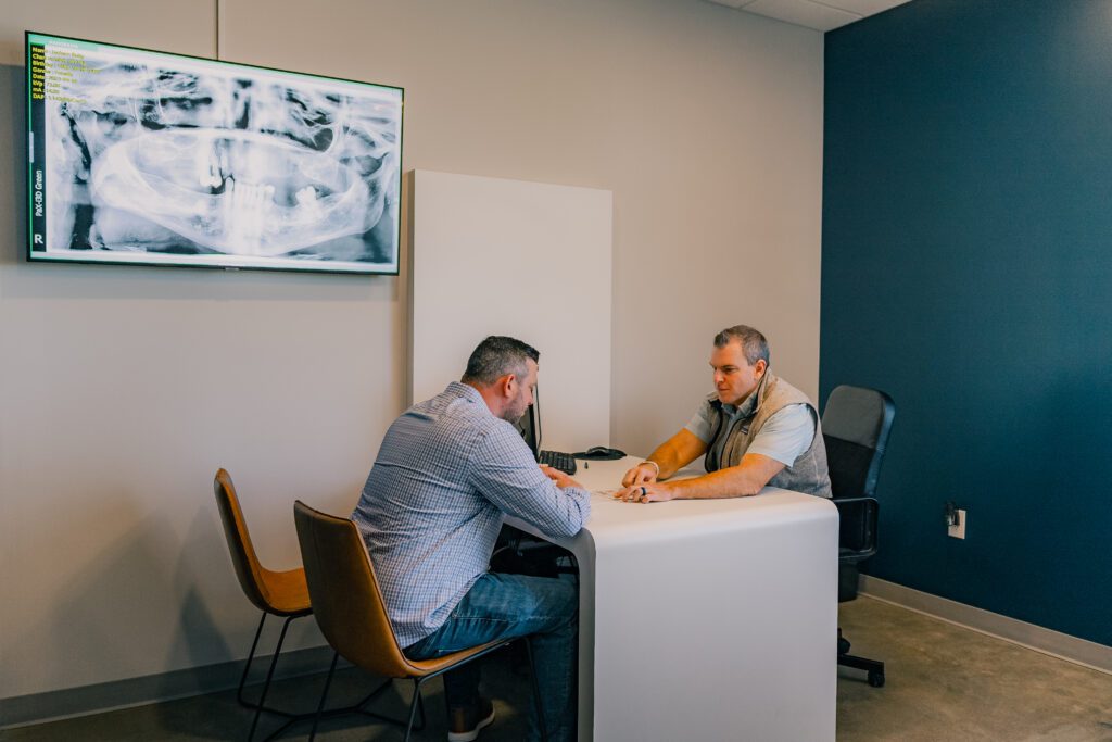 Dr. Leo discussing dental options with a patient